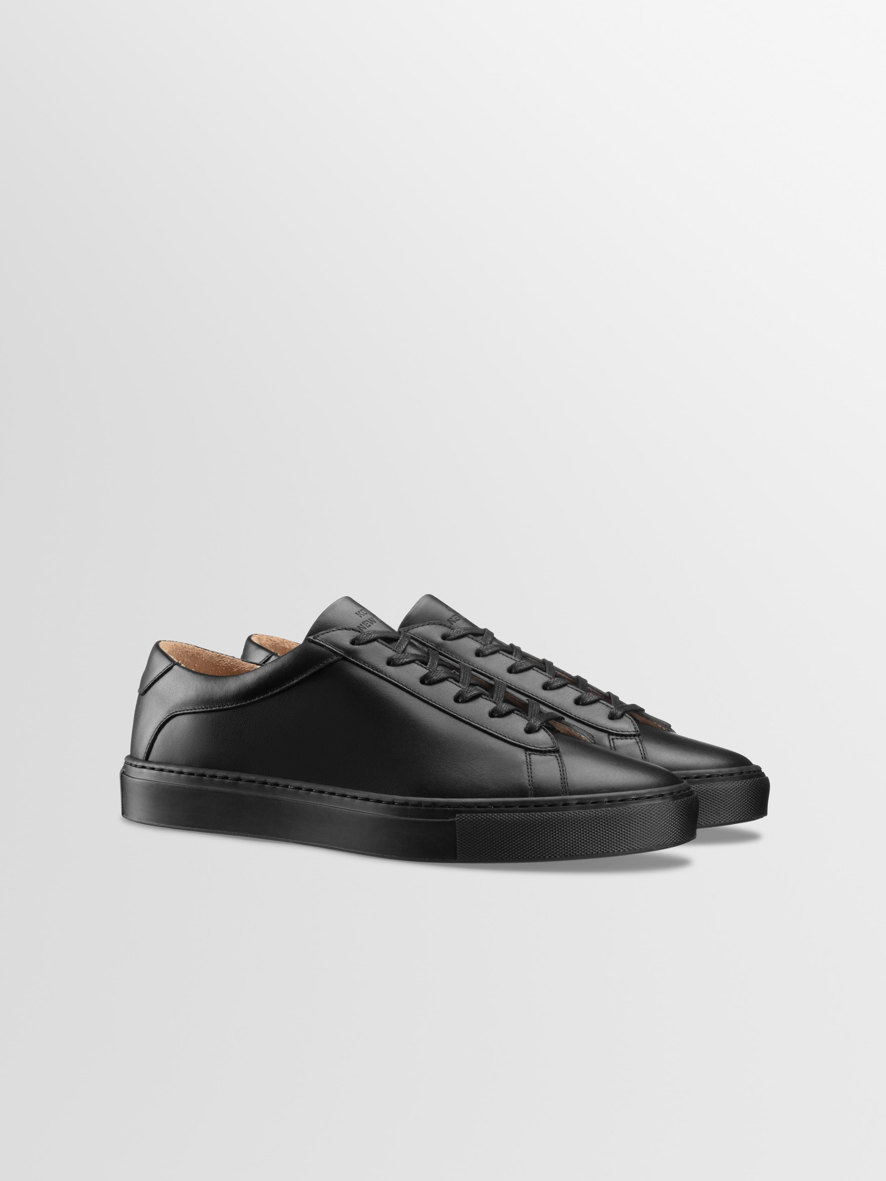 Completely black sneakers online